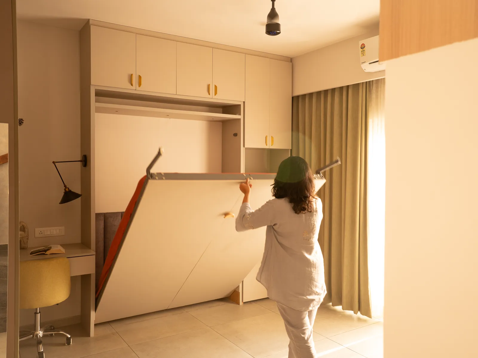 Wall bed folding down from the cabinet — Amlan's Residence